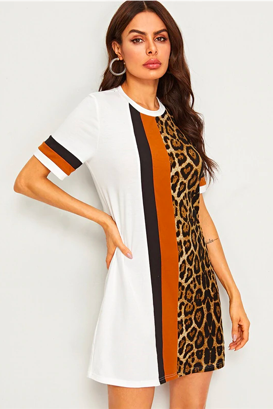 Model Woman Wearing A White T Shirt Dress With Bold Leopard Print Graphics And Orange And Black Stripes